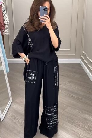 Костюм із штанів та асиметричної блузки, колір чорний